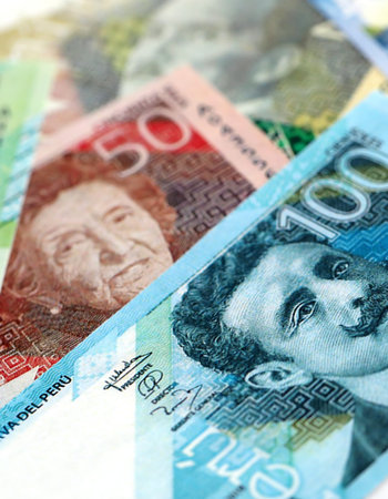 Peruvian sol paper banknotes pile on table. Peru PEN currency money bills in big amount. Concept of...