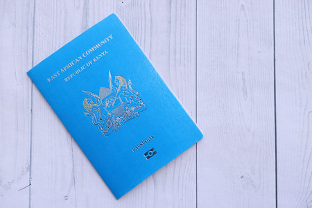 Kenyan passport on table close up. Official identification document book for citizens of Kenya....