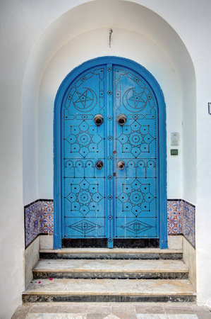 Blue wooden door in the old town of Fez, Morocco.の写真素材