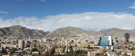 a beautiful bird eye view of tehran metropolitan city with a beautiful rainbow background