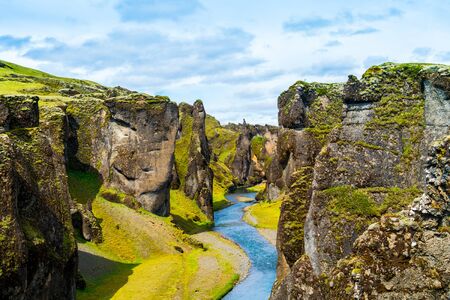 Iceland canyon fjaÃ°rÃ¡rgljÃºfur with river flowing through itの写真素材