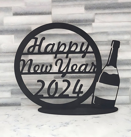 Happy New Year 2021 greeting card with a bottle of wine and a glass on a white marble tableの素材