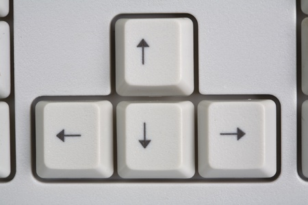 The four keyboard arrow keys on a white backgroundの写真素材