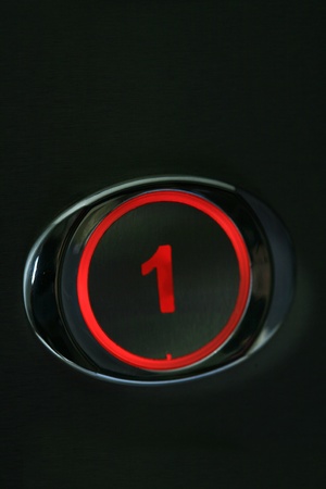 illuminating the image of a black background on the elevator buttonsの写真素材