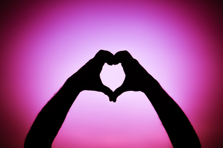 Silhouette of a team of people hands shows gesture okの写真素材