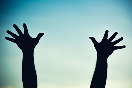 Silhouette of a team of people hands shows gesture okの写真素材