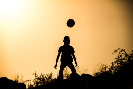 two brothers, boys play at sunset.の写真素材
