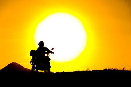 silhouette of the mountain motor driveの写真素材