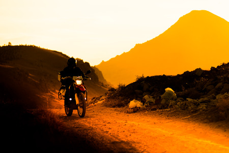 silhouette of the mountain motor driveの写真素材