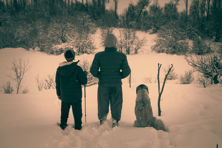 Hiker in winter in mountainsの写真素材