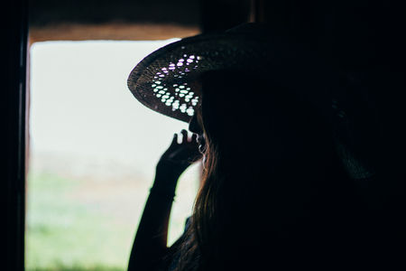 woman facing out of the windowの写真素材