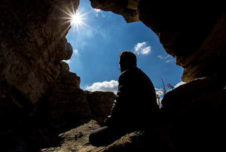 shooting a model in front of the caveの写真素材