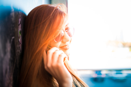 Beautiful girl drinking coffee at the coffee shopの写真素材