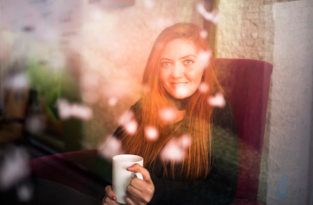 Beautiful girl drinking coffee at the coffee shopの写真素材