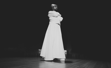 the image of a whirling Dervish in the darknessの写真素材