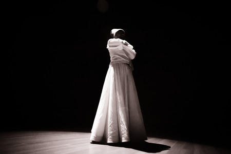 the image of a whirling Dervish in the darknessの写真素材