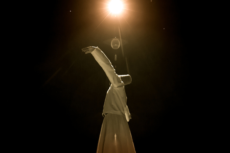 the image of a whirling Dervish in the darknessの写真素材