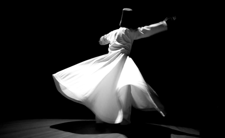 the image of a whirling Dervish in the darknessの写真素材