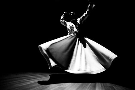 the image of a whirling Dervish in the darknessの写真素材