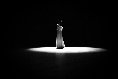 the image of a whirling Dervish in the darknessの写真素材