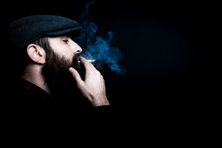 Charismatic man on black groundの写真素材