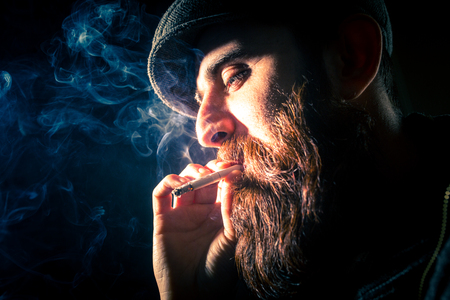 Charismatic man on black groundの写真素材