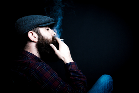 Charismatic man on black groundの写真素材