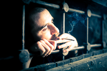 a helpless prisoner between the barsの写真素材