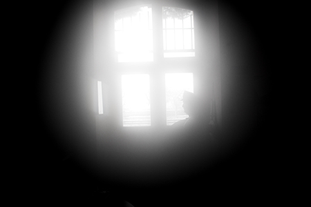 silhouette image of station attendant looking at window