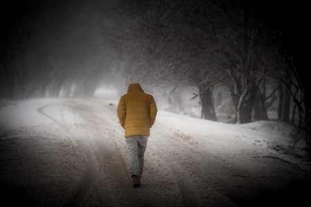 the man who is in the road that is snowの写真素材
