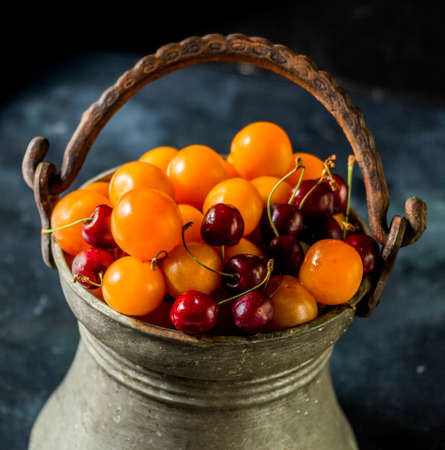 Cherries and plums in the old transport container