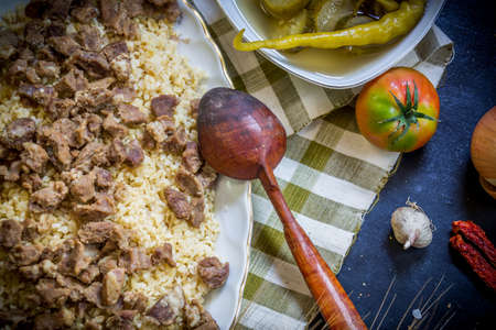 Meats sprinkled on bulgur pilaf