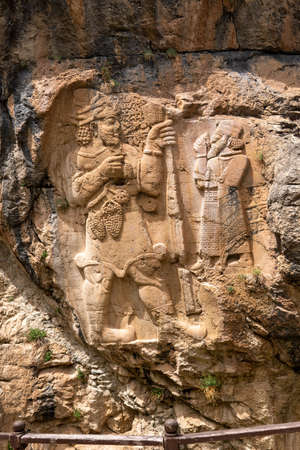 Statues carved on the rock at the entrance to the ancient city of Side, Turkey
