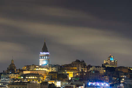 Istanbul Galata Tower Against Cloudy Skyの写真素材