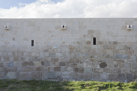 cast wall with sky and cloudsの写真素材
