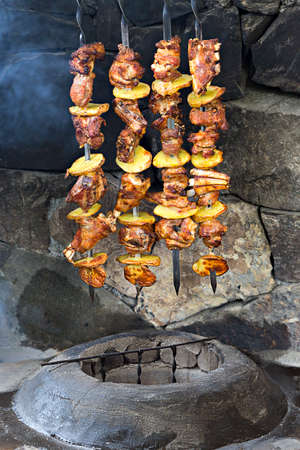 Lamb and chicken kebabs with potatoes on the skewer, out of tandoori oven.の写真素材