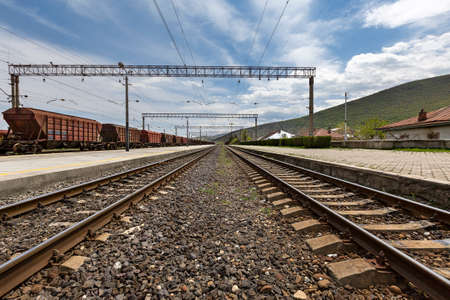 Rail road tracks and train cars in Gori, Georgia