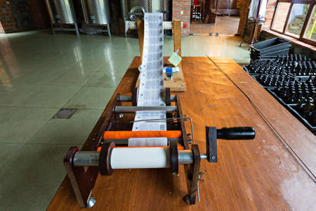 Label printing machine in winery, Batumi, Georgia.のeditorial素材