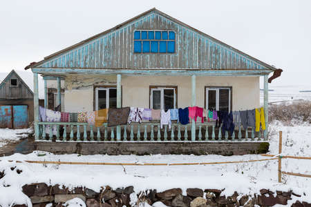 Village house with colorful laundry in Georgiaの写真素材
