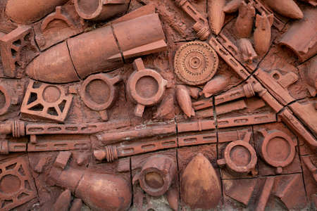 Soviet era reliefs representing war epics, on terra cotta wall, in Kutaisi, Georgia