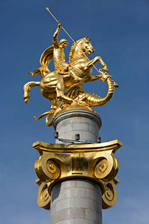 Gold covered statue of St George in the Freedom Square in Tbilisi, Georgia.のeditorial素材