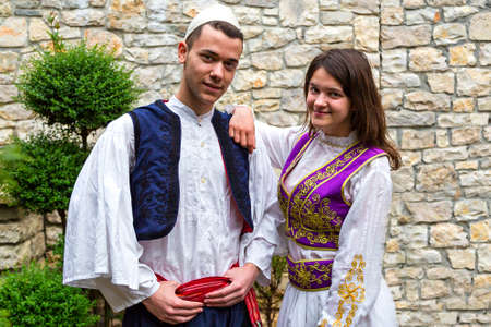 Young Albanian couple in national costumes, in Berat, Albania.のeditorial素材