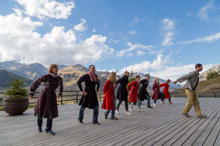 Georgian people in local dresses perform Georgian folk dance, Georgia, Caucasus Mountains.のeditorial素材