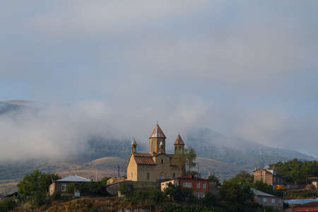 Church in the fog and clouds in Akhaltsikhe, Georgia