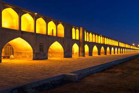 Siosepol Bridge in Isfahan, Iran, at the twilight. The river is missing due to the shortage of rain fallの写真素材