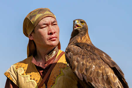 Eagle hunter and his Golden Eagle, in Almaty, Kazakhstanのeditorial素材