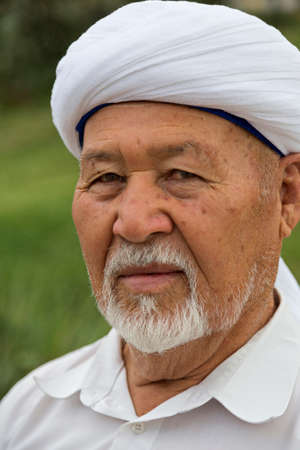 Elderly Kazakh man wearing a turban in Shymkent, Kazakhstanのeditorial素材