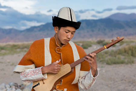 Musician playing local traditional instrument, in Issyk Kul, Kyrgyzstanのeditorial素材
