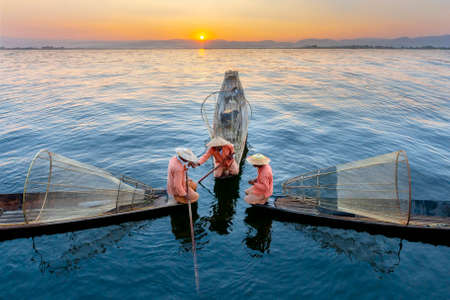 Fishermen at the sunrise in Inle Lake known also as leg rowers, Myanmarのeditorial素材