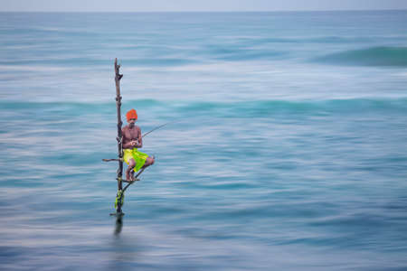 Fisherman on stilt in Galle, Sri Lanka.のeditorial素材